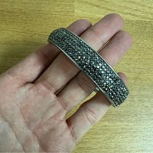 Silver tone hinged bangle rigid bracelet with gunmetal silver druzy crystal